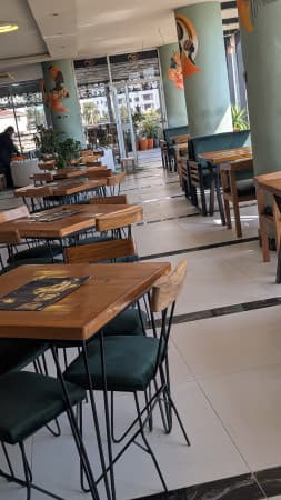 አረንጕዴ ጥላ Cafe And Restaurant cover